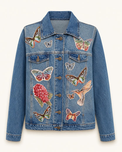 Chaqueta denim azul con mariposas y ave