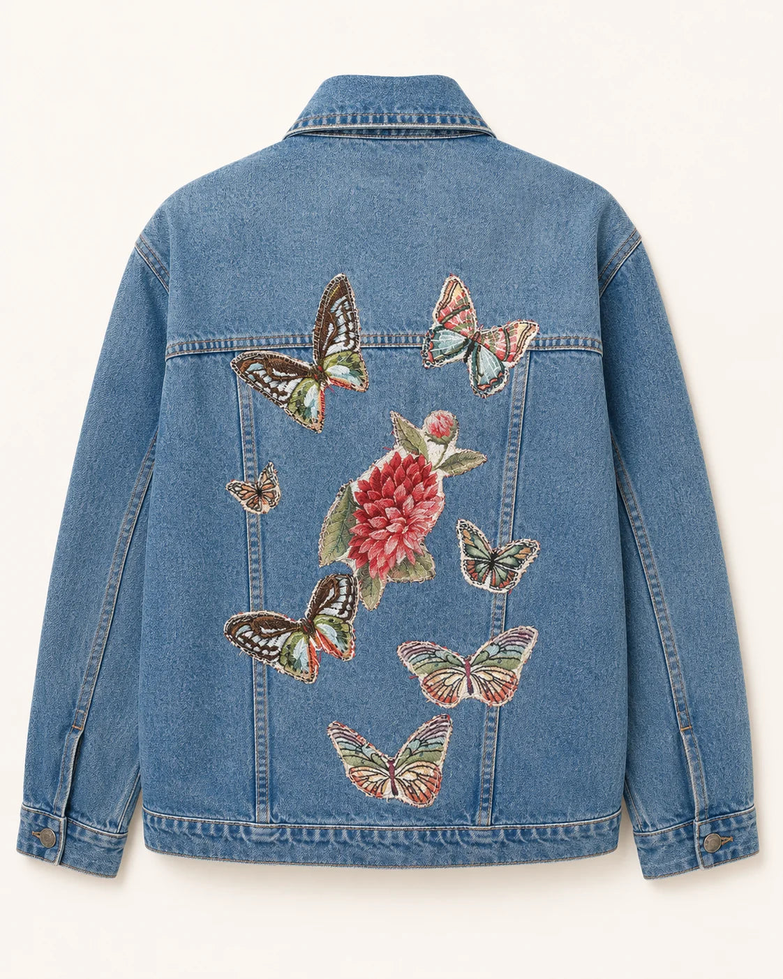 Chaqueta denim azul con mariposas y ave