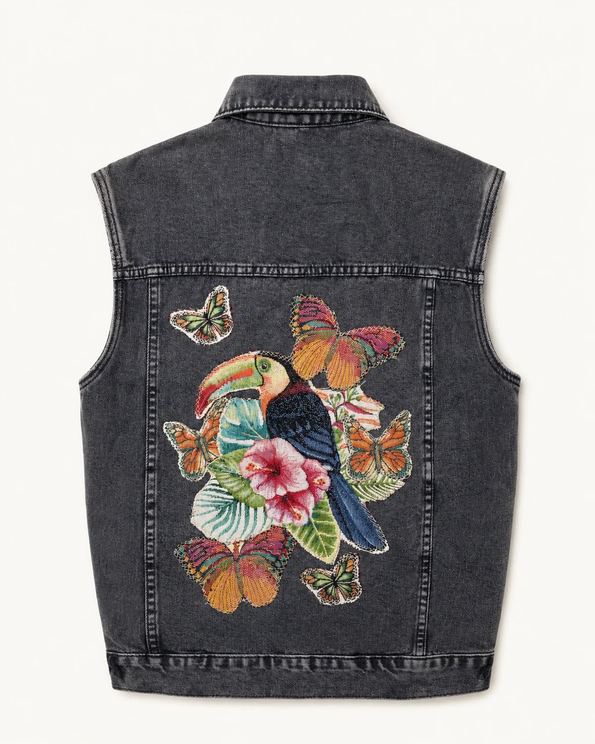 Chaleco de denim negro con aplicaciones tropicales